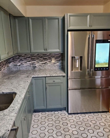 Before and after kitchen remodel by American Home Remodeling Service - sage green cabinets